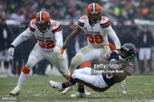 Tarik Cohen of the Chicago Bears catches the football in front of Christian Kirksey of the Cleveland Browns in the third quarter at Soldier Field on...