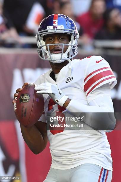 Quarterback Geno Smith of the New York Giants warms up for the NFL game against the Arizona Cardinals in the first half at University of Phoenix...