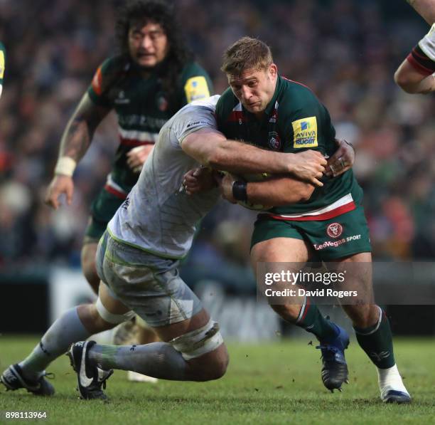 Tom Youngs of Leicester is tackled by George Kruis during the Aviva Premiership match between Leicester Tigers and Saracens at Welford Road on...