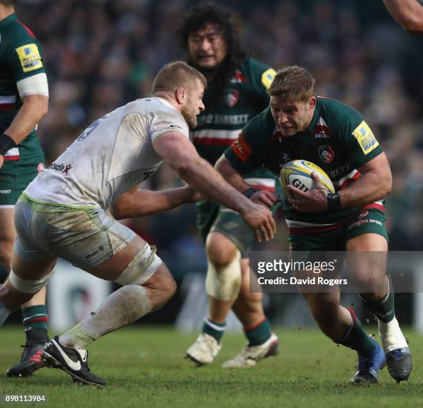 Tom Youngs of Leicester is tackled by George Kruis during the Aviva Premiership match between Leicester Tigers and Saracens at Welford Road on...