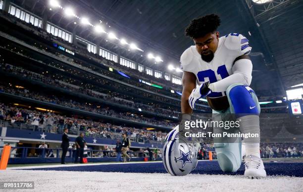 Ezekiel Elliott of the Dallas Cowboys kneels before taking on the Seattle Seahawks at AT&T Stadium on December 24, 2017 in Arlington, Texas.