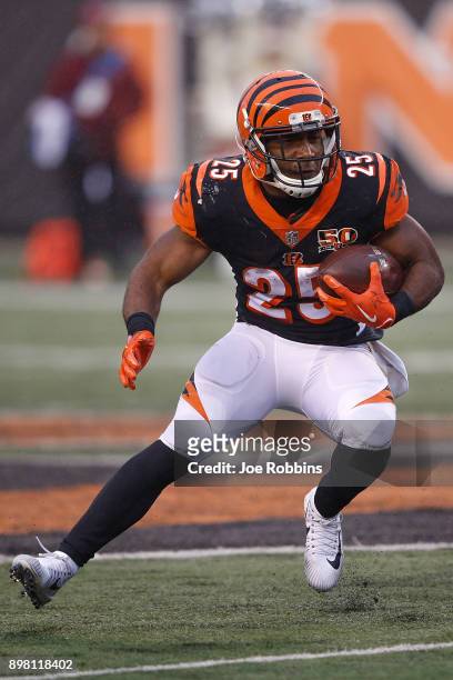 Giovani Bernard of the Cincinnati Bengals runs with the ball against the Detroit Lions during the second half at Paul Brown Stadium on December 24,...