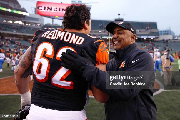 Head coach Marvin Lewis of the Cincinnati Bengals celebrates with Alex Redmond after the game against the Detroit Lions at Paul Brown Stadium on...