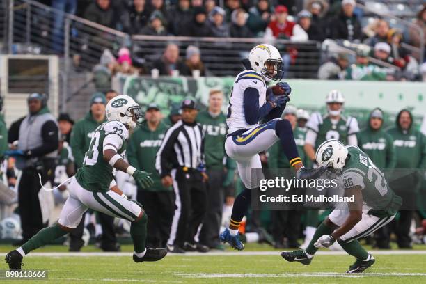 Keenan Allen of the Los Angeles Chargers makes the catch under pressure from Jamal Adams and Marcus Maye of the New York Jets during the second half...