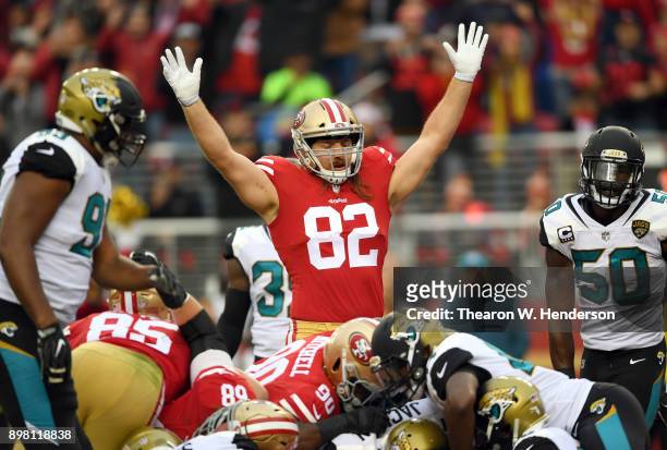 Logan Paulsen of the San Francisco 49ers signals touchdown after quarterback Jimmy Garoppolo scored on a 1-yard touchdown run against the...