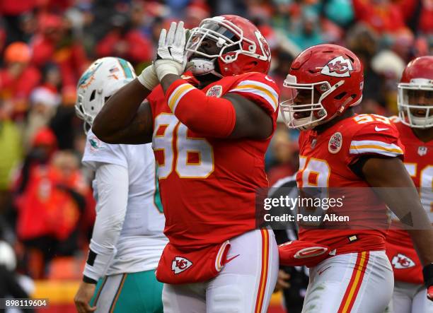 Nose tackle Bennie Logan of the Kansas City Chiefs celebrates a tackle in the backfield during the third quarter of the game against the Miami...