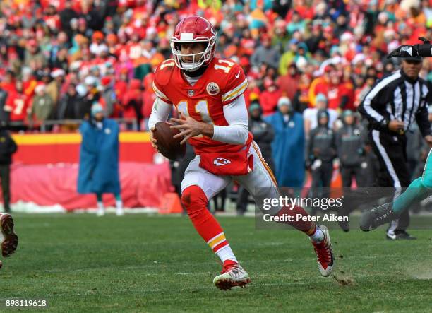 Quarterback Alex Smith of the Kansas City Chiefs runs out of the pocket in the fourth quarter of the game against the Miami Dolphins at Arrowhead...