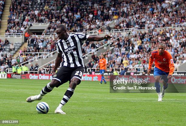 Shola Ameobi of Newcastle United shoots to score the 3:0 goal from the penalty spot during the Coca-Cola Championship match between Newcastle United...