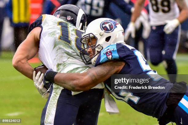 Wide Receiver Cooper Kupp of the Los Angeles Rams carries the ball against Linebacker Avery Williamson of the Tennessee Titans at Nissan Stadium on...