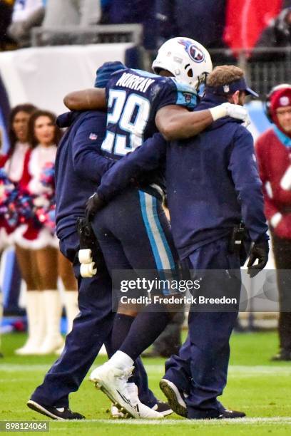 DeMarco Murray of the Tennessee Titans is helped off the field during the game against the Los Angeles Rams at Nissan Stadium on December 24, 2017 in...