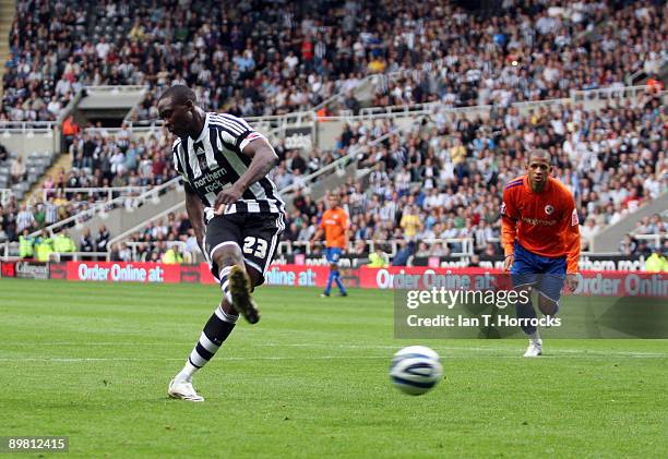 Shola Ameobi of Newcastle United shoots to score the 3:0 goal from the penalty spot during the Coca-Cola Championship match between Newcastle United...