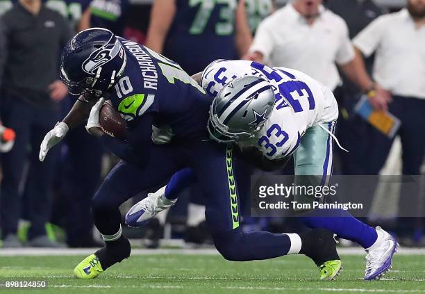 Paul Richardson of the Seattle Seahawks is tackled by Chidobe Awuzie of the Dallas Cowboys in the first quarter of a football game at AT&T Stadium on...