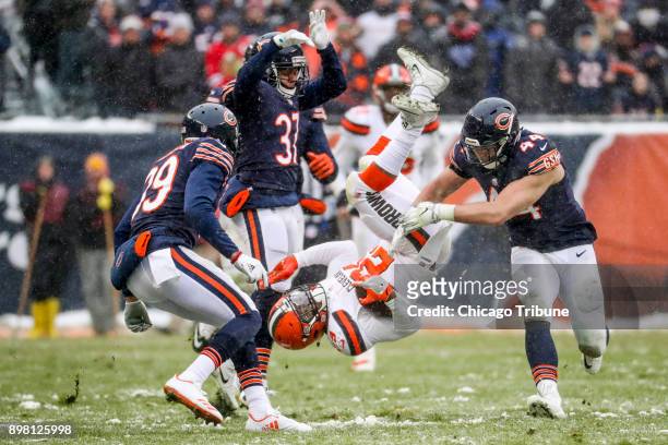 Chicago Bears cornerback Bryce Callahan flips Cleveland Browns running back Duke Johnson during the second half at Soldier Field Sunday Dec. 24 in...