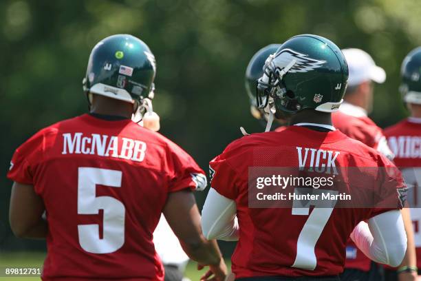 Quarterback Michael Vick and quarterback Donovan McNabb of the Philadelphia Eagles practice during training camp on August 15, 2009 at the NovaCare...