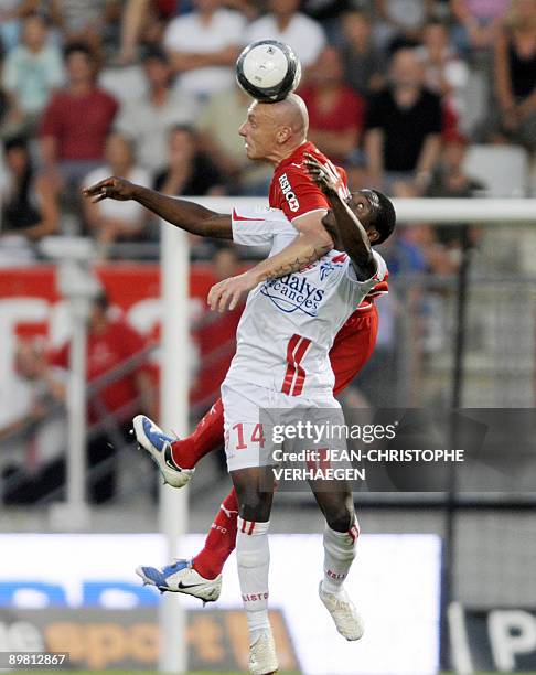 Nancy's forward Paul Alo'o Efoulou fights for the ball with Monaco's defender Sebastien Puygrenier during their french L1 football match Nacy vs...