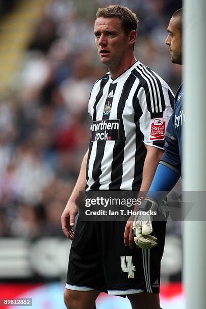 Kevin Nolan of Newcastle United looks on beside Reading's goalkeeper Adam Federici during the Coca-Cola Championship game between Newcastle United...