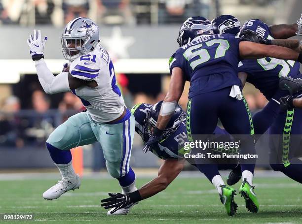 Ezekiel Elliott of the Dallas Cowboys carries the ball against the Seattle Seahawks in the second quarter at AT&T Stadium on December 24, 2017 in...