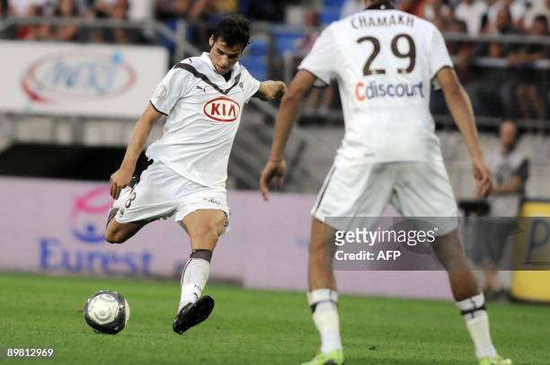 Bordeaux' midfielder Yoann Gourcuff kicks the ball in front of Bordeaux' Moroccan forward Marouane Chamakh during the French L1 football match...