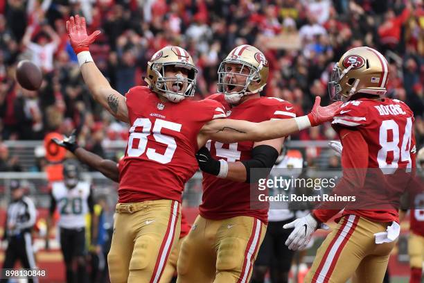 George Kittle of the San Francisco 49ers celebrates after scoring on a eight-yard touchdown catch against the Jacksonville Jaguars during their NFL...