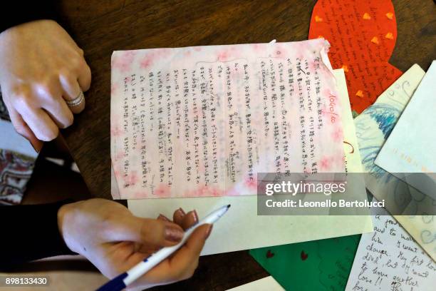 The Juliet Club's team of volunteers responsible for replying to letters received from all over the world pose in Via Cappello 23, which is today...