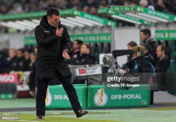 Head coach Dieter Hecking of Moenchengladbach gestures during the DFB Cup match between Borussia Moenchengladbach and Bayer Leverkusen at...