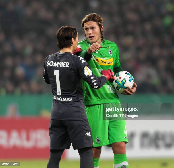 Jannik Vestergaard of Moenchengladbach speaks with Goalkeeper Yann Sommer during the DFB Cup match between Borussia Moenchengladbach and Bayer...