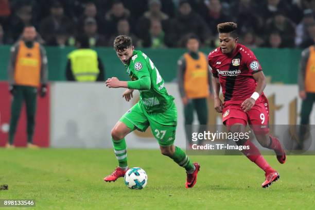 Mickael Cuisance of Moenchengladbach and Leon Bailey of Leverkusen battle for the ball during the DFB Cup match between Borussia Moenchengladbach and...