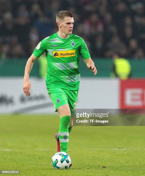 Matthias Ginter of Moenchengladbach controls the ball during the DFB Cup match between Borussia Moenchengladbach and Bayer Leverkusen at...