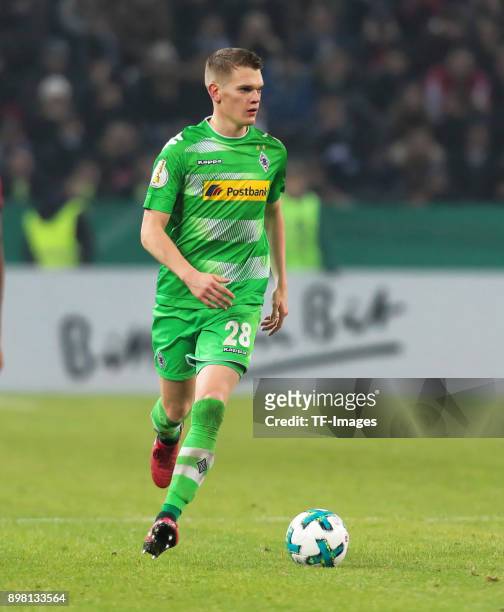 Matthias Ginter of Moenchengladbach controls the ball during the DFB Cup match between Borussia Moenchengladbach and Bayer Leverkusen at...
