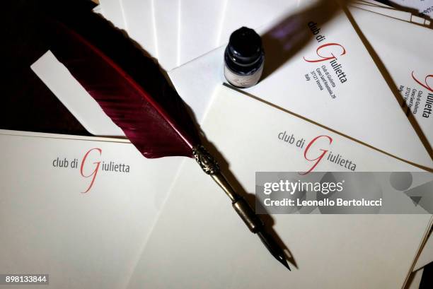 In this photo illustration a writing quill and headed writing paper are displayed in Via Cappello 23, which is today known as “Juliet’s House” on...