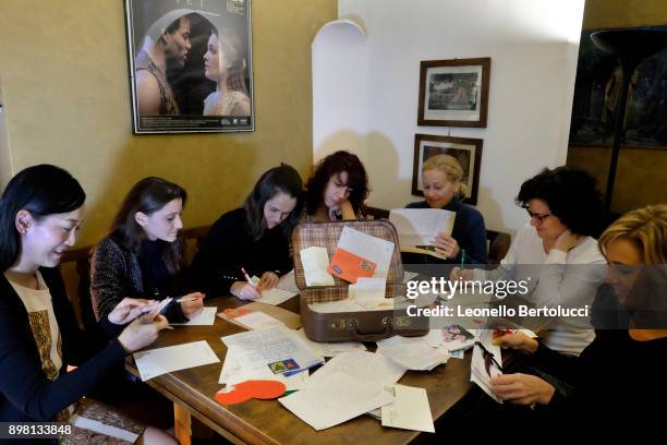 The Juliet Club's team of volunteers responsible for replying to letters received from all over the world pose in Via Cappello 23, which is today...