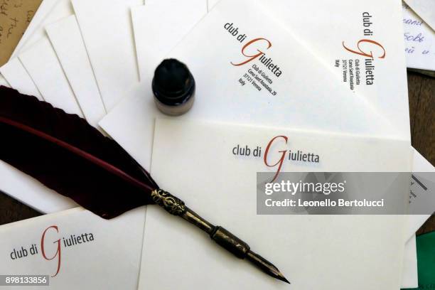 In this photo illustration a writing quill and headed writing paper are displayed in Via Cappello 23, which is today known as “Juliet’s House” on...