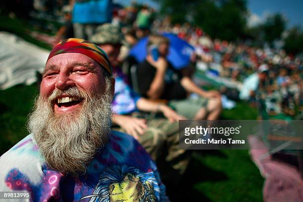Roger Morris laughs as he waits for the start of the concert marking the 40th anniversary of the Woodstock music festival August 15, 2009 in Bethel,...
