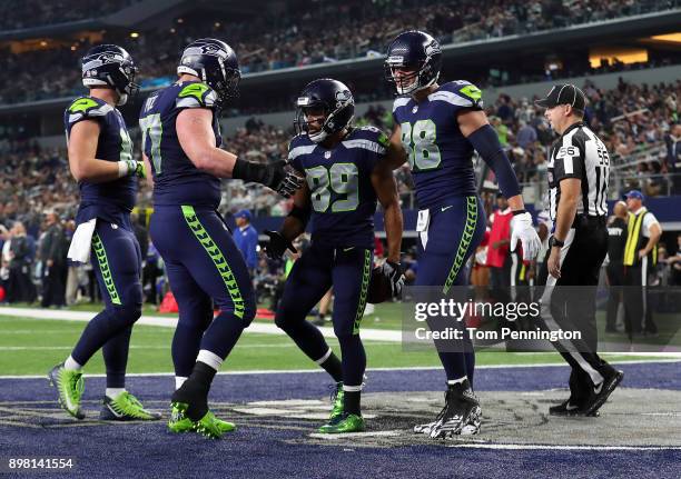 Ethan Pocic of the Seattle Seahawks and Jimmy Graham of the Seattle Seahawks celebrate the touchdown by Doug Baldwin of the Seattle Seahawks in the...