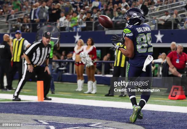 Doug Baldwin of the Seattle Seahawks makes a touchdown reception in the fourth quarter against the Dallas Cowboys at AT&T Stadium on December 24,...