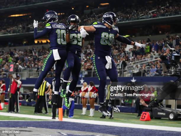Paul Richardson of the Seattle Seahawks, Doug Baldwin of the Seattle Seahawks, and Jimmy Graham of the Seattle Seahawks celebrate the touchdown by...