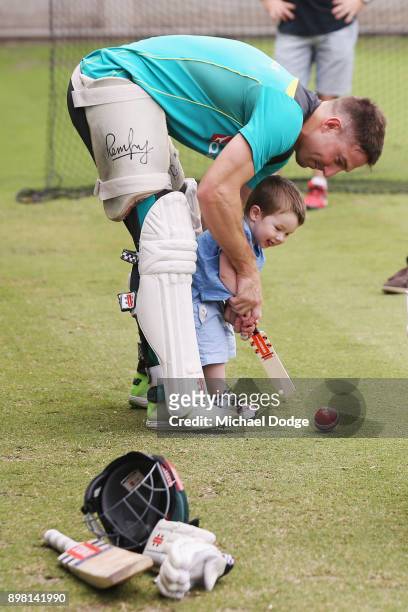 Shaun Marsh watches son Austin hit the ball during the Australian nets session at the on December 25, 2017 in Melbourne, Australia.