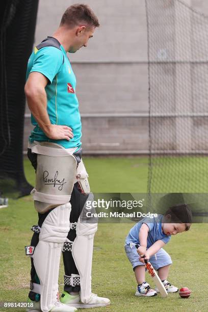 Shaun Marsh watches son Austin hit the ball during the Australian nets session at the Melbourne Cricket Ground on December 25, 2017 in Melbourne,...