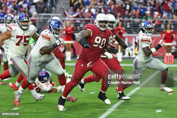 Defensive tackle Robert Nkemdiche of the Arizona Cardinals runs in a 21 yard fumble recovery touchdown against the New York Giants in the second half...