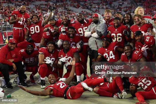 Players from the Arizona Cardinals defense pose together during the final moments of the second half of the NFL game against the New York Giants at...