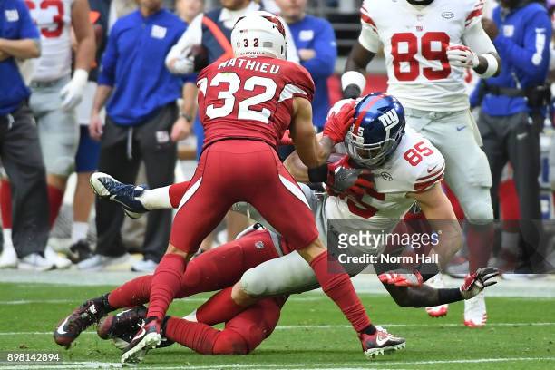 Tight end Rhett Ellison of the New York Giants carries the football against free safety Tyrann Mathieu of the Arizona Cardinals in the second half at...