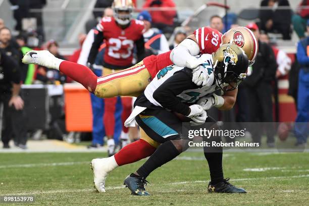 Yeldon of the Jacksonville Jaguars is tackled by Brock Coyle of the San Francisco 49ers during their NFL game at Levi's Stadium on December 24, 2017...