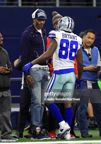 Former NBA player Kenyon Martin greets Dez Bryant of the Dallas Cowboys before a game against the Seattle Seahawks at AT&T Stadium on December 24,...