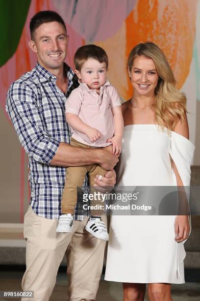 Shaun Marsh and Bec Marsh pose with son Austin at Crown Metropol after the Australian nets session on December 25, 2017 in Melbourne, Australia.
