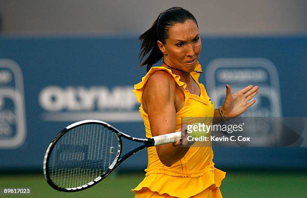 Jelena Jankovic of Serbia returns a shot to Elena Dementieva of Russia during the semifinals of the Western & Southern Financial Group Women's Open...