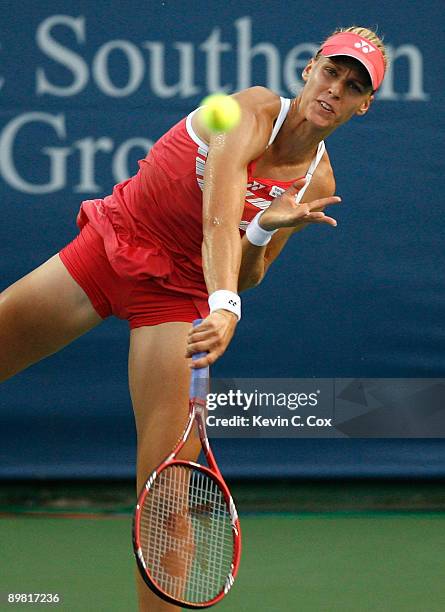 Elena Dementieva of Russia serves to Jelena Jankovic of Serbia during the semifinals of the Western & Southern Financial Group Women's Open on August...