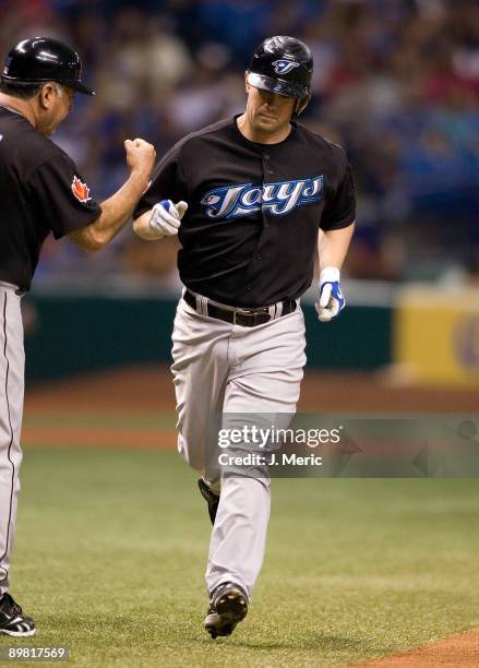 Infielder Aaron Hill of the Toronto Blue Jays rounds the bases after his third inning home run against the Tampa Bay Rays during the game at...