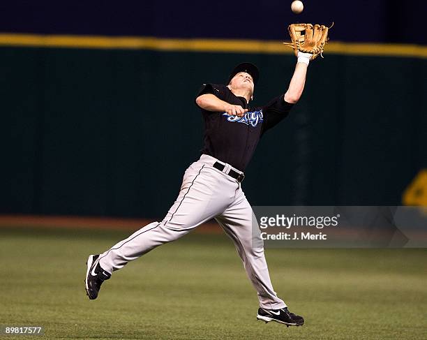 Infielder Aaron Hill of the Toronto Blue Jays catches a fly ball against the Tampa Bay Rays during the game at Tropicana Field on August 15, 2009 in...