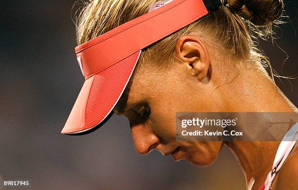 Elena Dementieva of Russia reacts after losing a game to Jelena Jankovic of Serbia during the semifinals of the Western & Southern Financial Group...