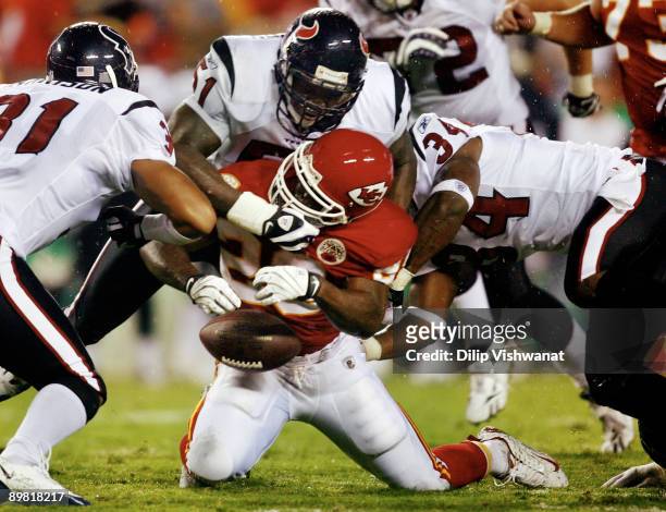 Running Back Dantrell Savage of the Kansas City Chiefs fumbles the ball during the preseason game against the Houston Texans at Arrowhead Stadium on...